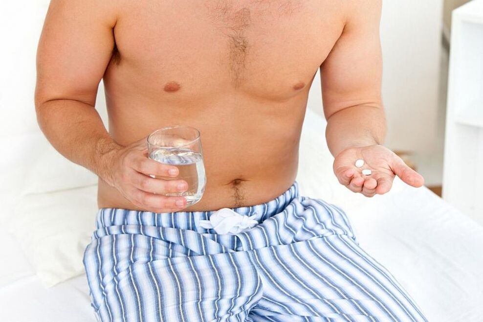 Man taking medicine for prostatitis