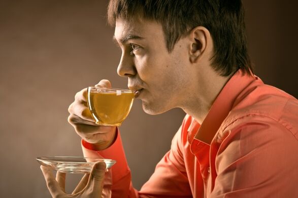 A man drinks herbal tea to treat prostatitis